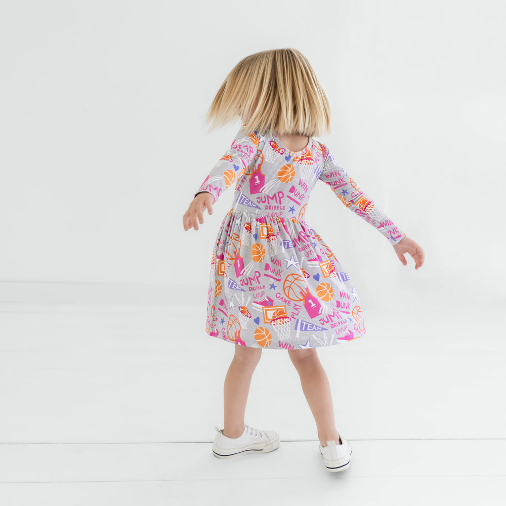 Twirling child wearing the Pink Slam Dunk Skater Dress