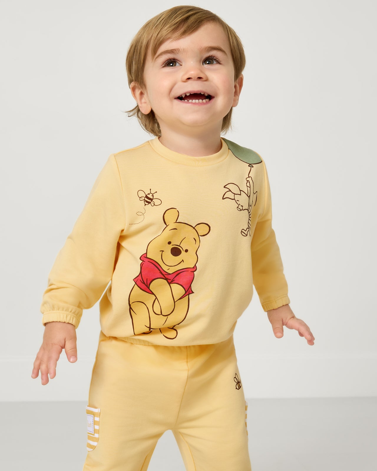 Boy wearing the Disney Winnie The Pooh Cinched Crewneck