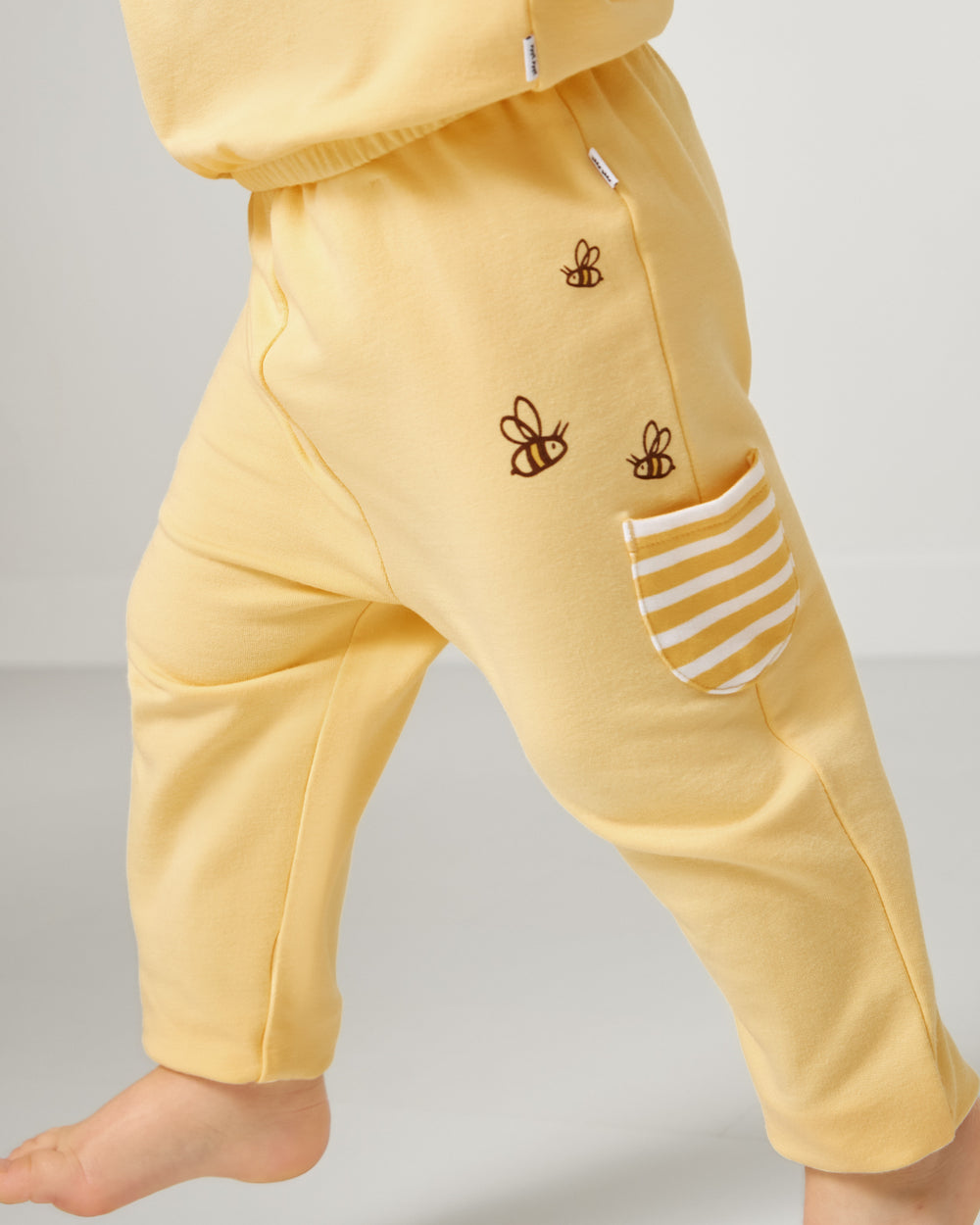 Close up of child wearing the Disney Winnie The Pooh Cinched Jogger