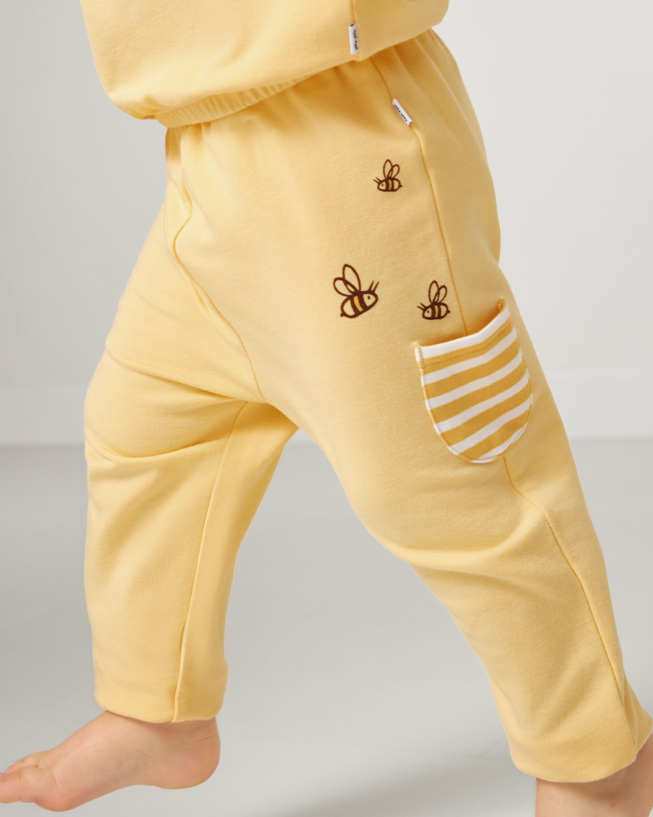 Close up of child wearing the Disney Winnie The Pooh Cinched Jogger