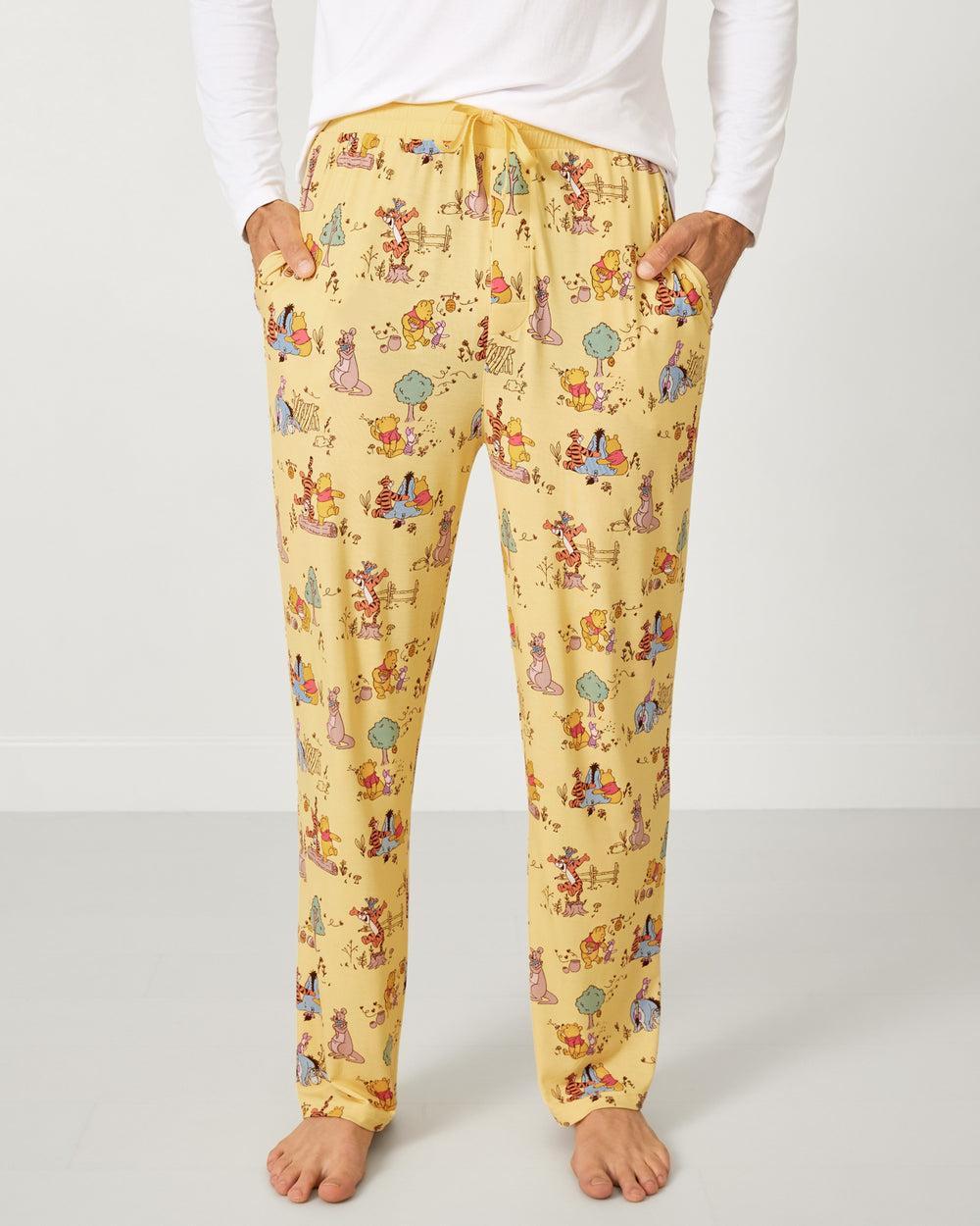 Man wearing the Disney Playtime With Pooh Men's Pajama Pants