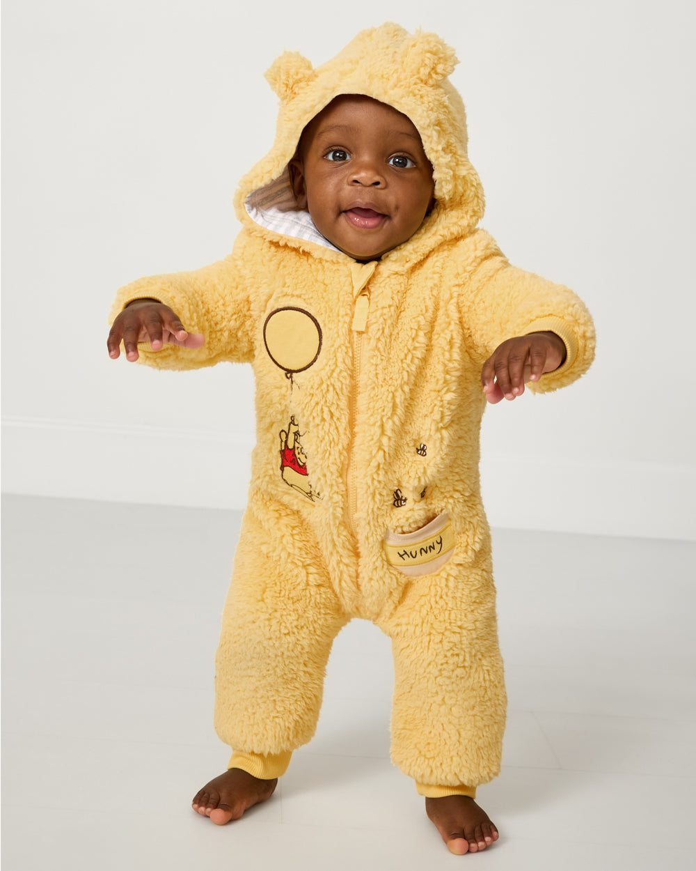 Baby wearing the Disney Winnie the Pooh Sherpa Romper