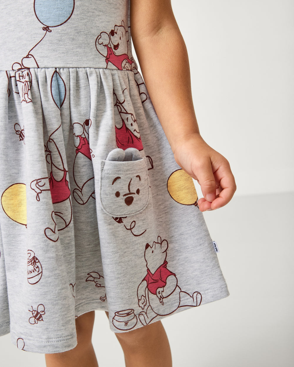 Close up of the pocket detail on the Disney Up, Up and Away Patch Pocket Dress