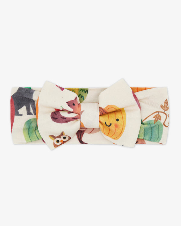 Flat lay of the Pumpkin Pals Luxe Bow Headband