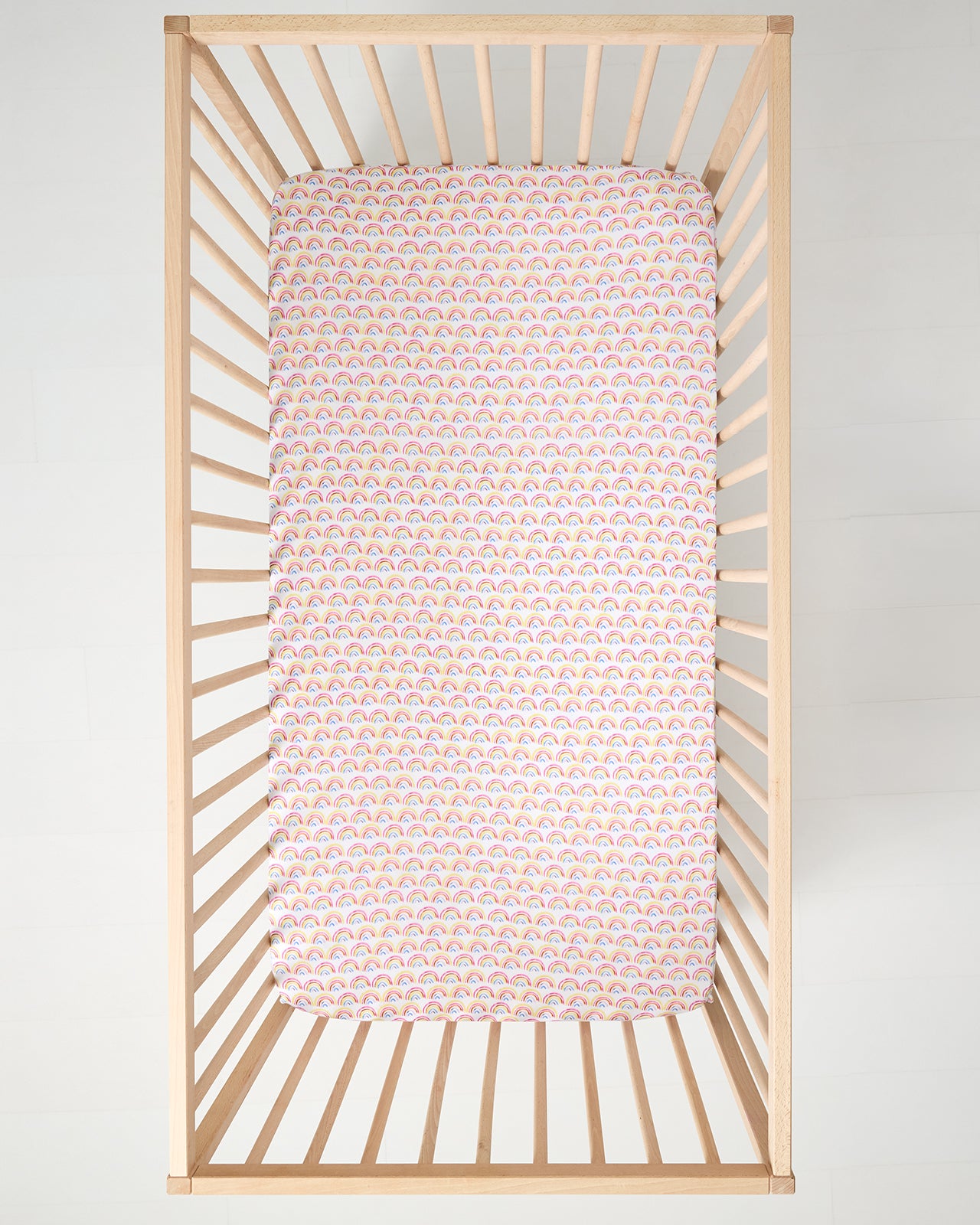 Aerial view of the Pastel Rainbows Fitted Crib Sheet