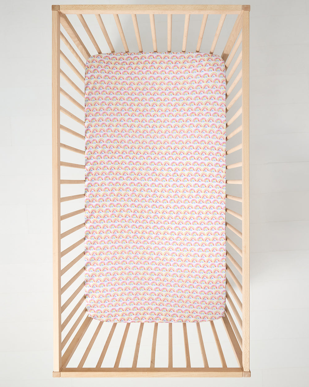Aerial view of the Pastel Rainbows Fitted Crib Sheet