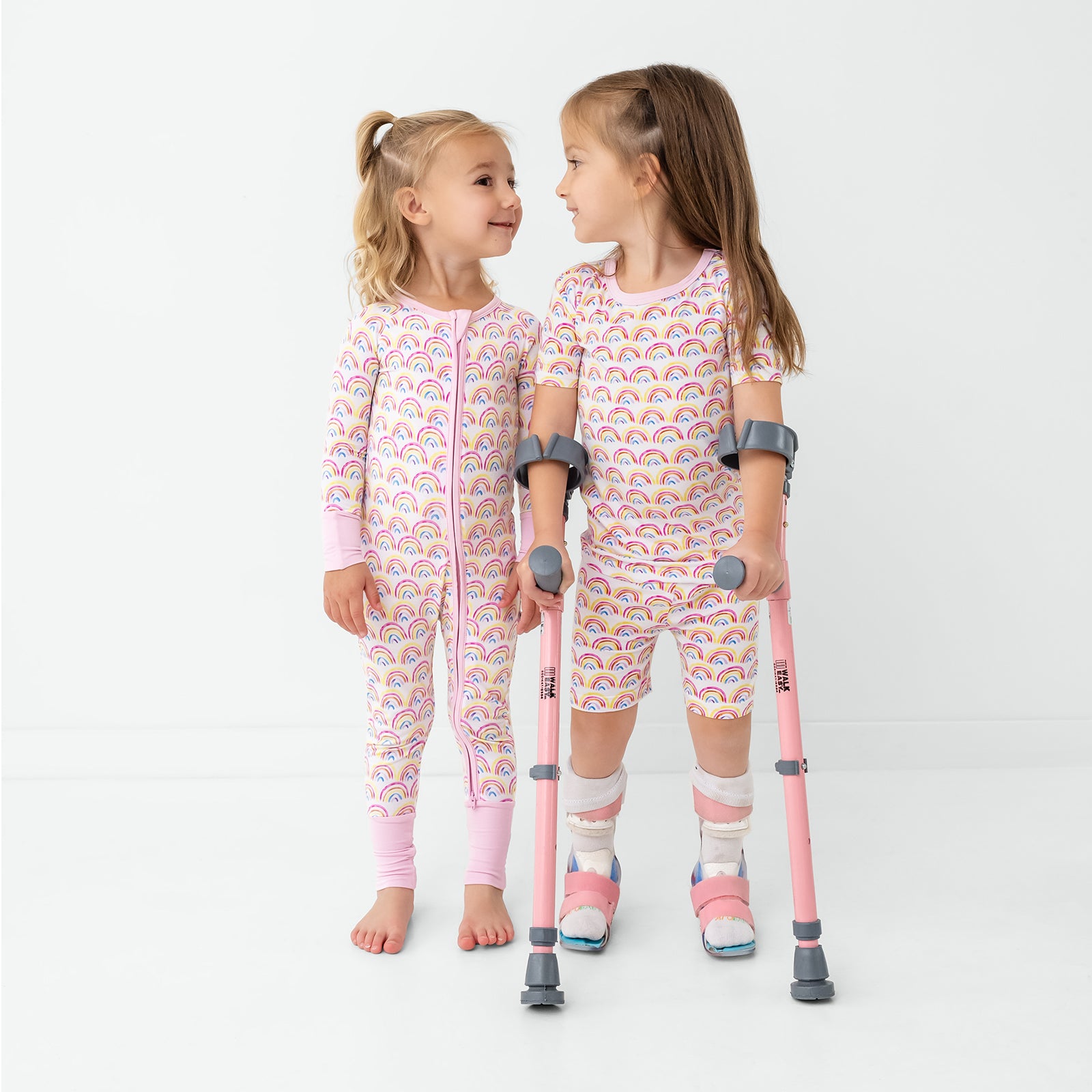 Two girls wearing matching Pastel Rainbows Pajamas
