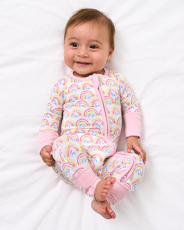 Aerial view of baby wearing the Pastel Rainbows Zippy