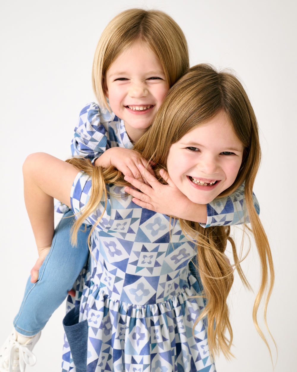 Two girls wearing matching Patchwork Indigo play styles