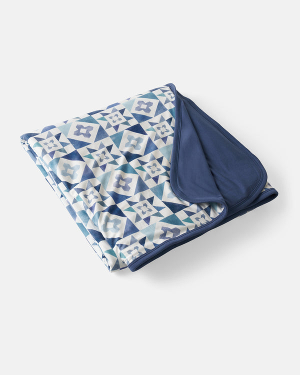 Flat lay of the Patchwork Indigo Oversized Cloud Blanket®