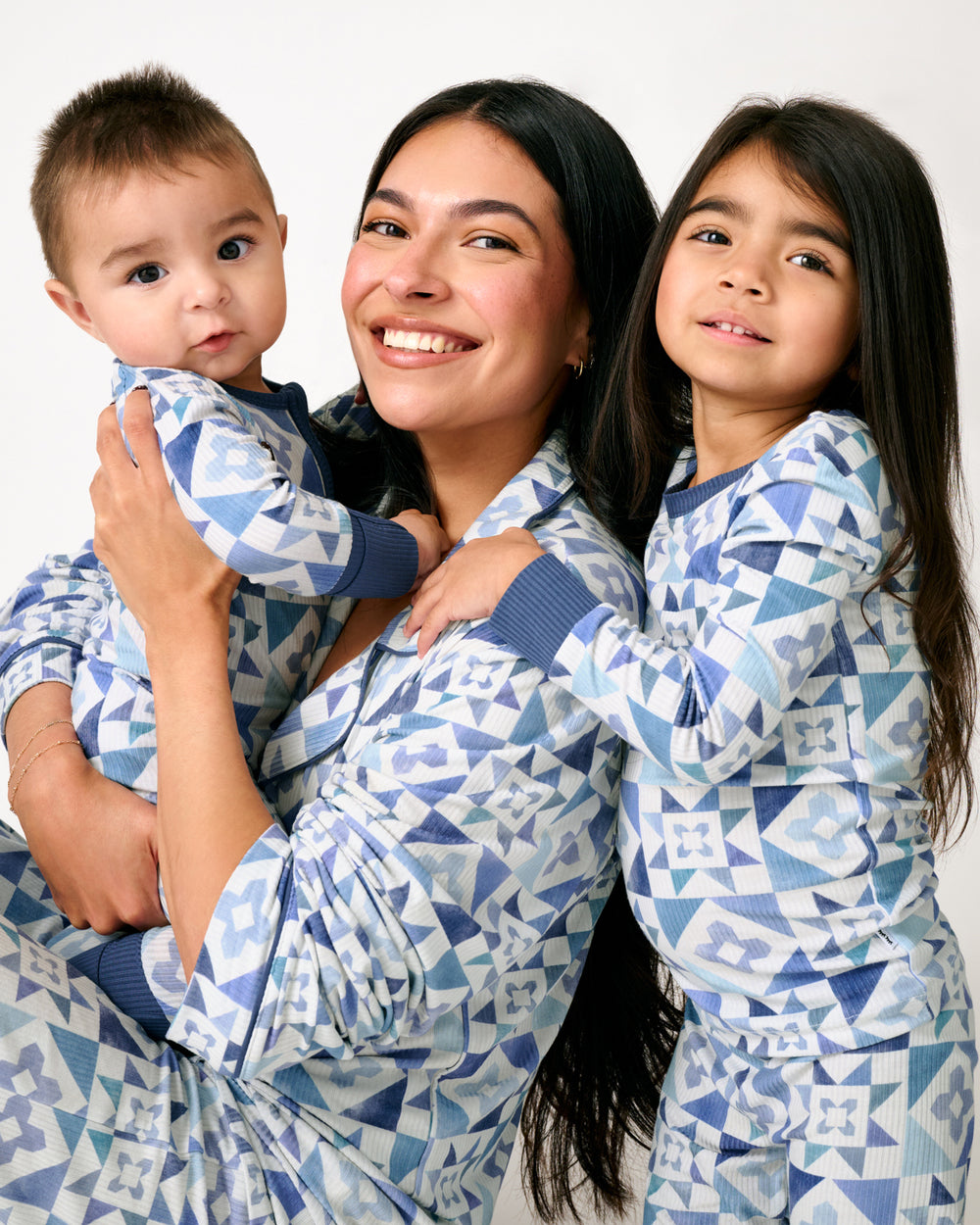 Mother and two children wearing Patchwork Indigo Ribbed Pajamas