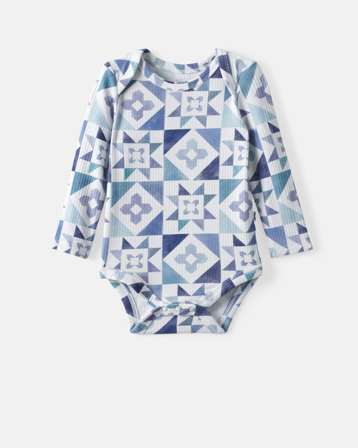 Flat lay of the Patchwork Indigo Ribbed Bodysuit