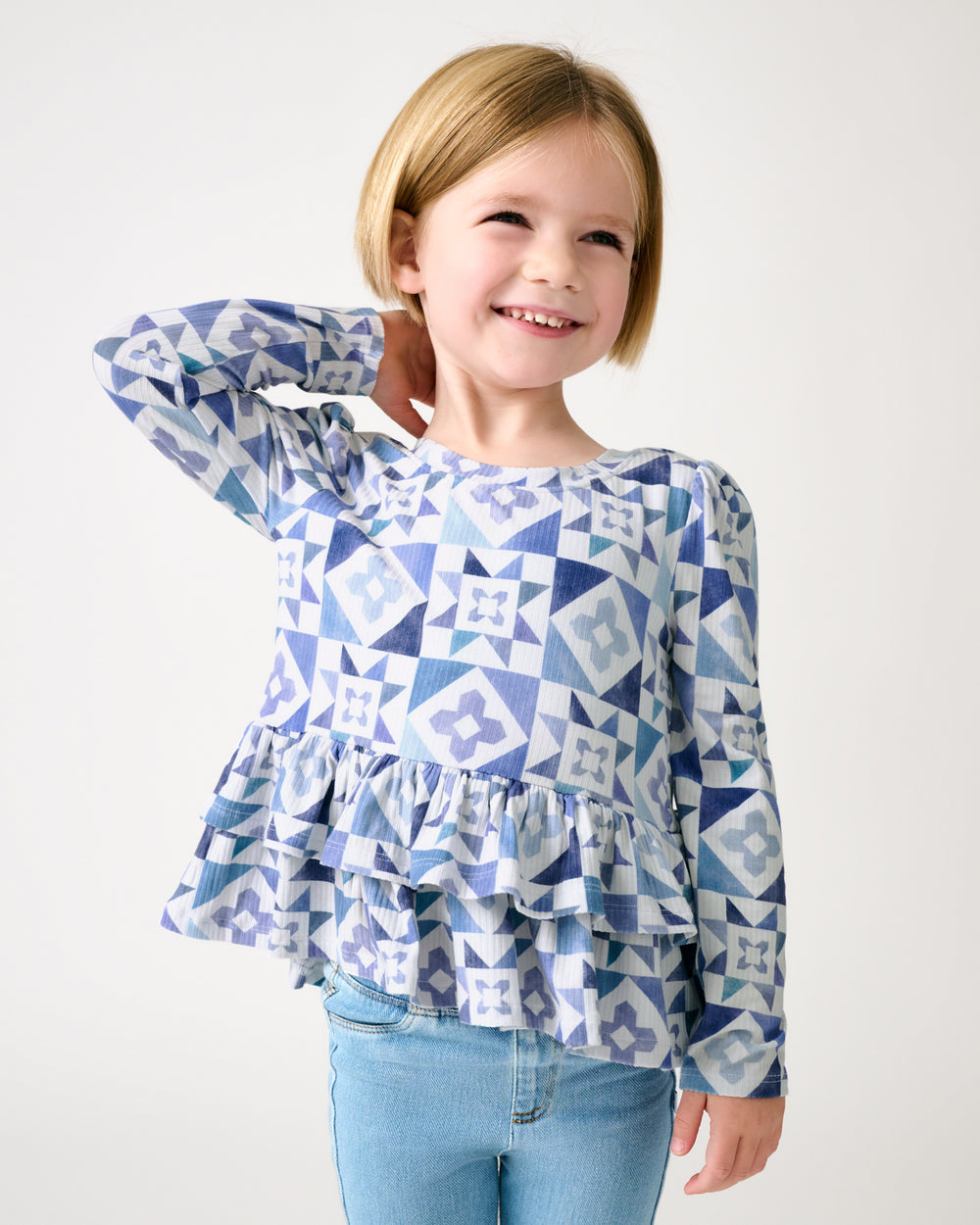 Girl wearing the Patchwork Indigo Ribbed Peplum Top