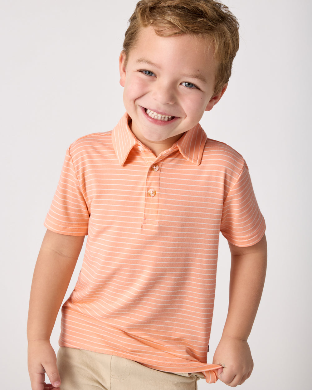 Boy wearing the Peachy Keen Stripe Polo Shirt
