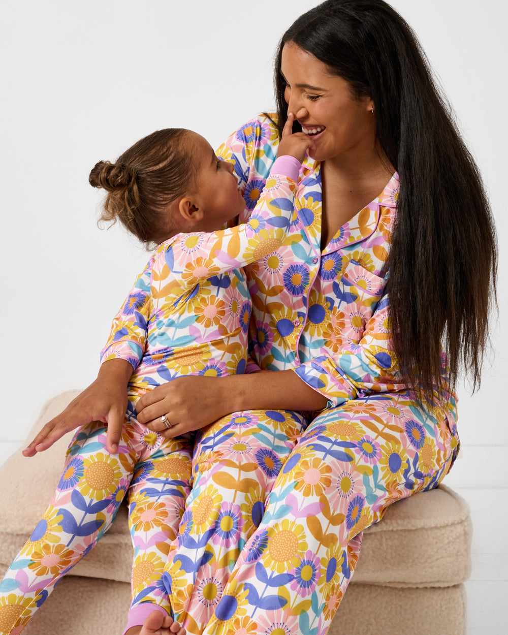 Mother and daughter wearing matching Petal Power Floral Pajama Sets