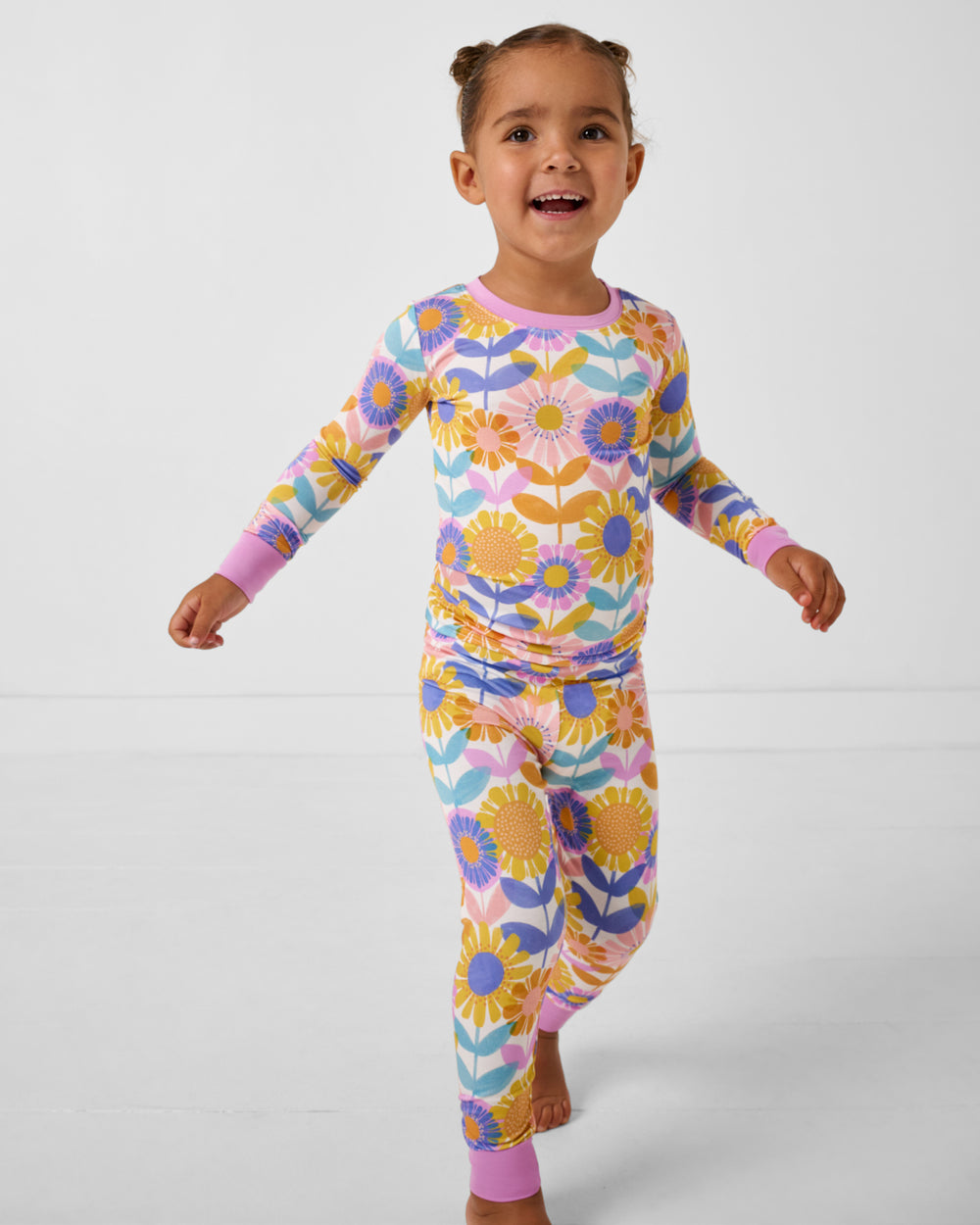 Walking girl wearing the Petal Power Two-Piece Pajama Set
