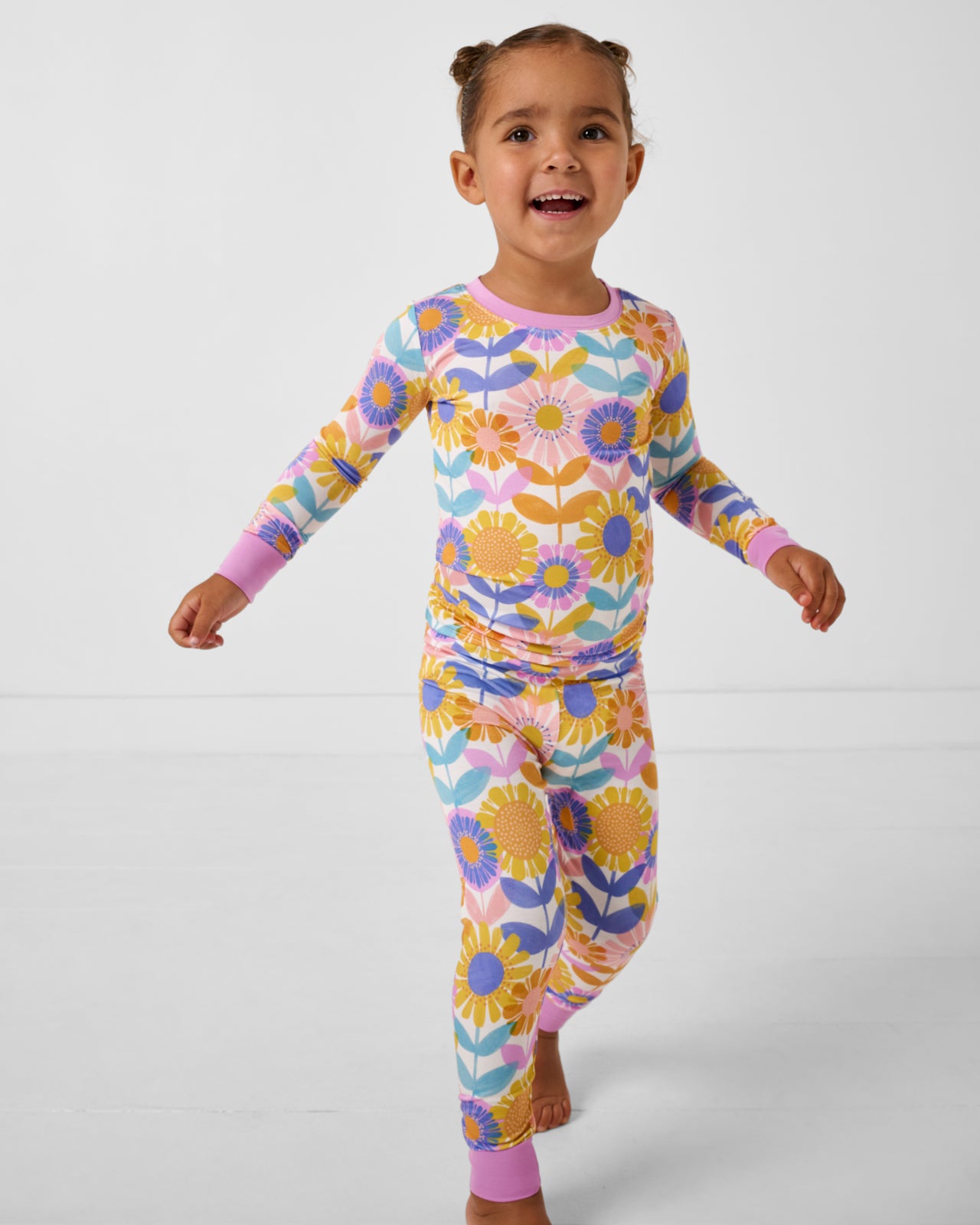 Walking girl wearing the Petal Power Two-Piece Pajama Set