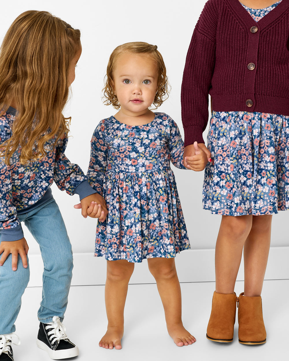 Group of three girls wearing matching Petite Petals play styles