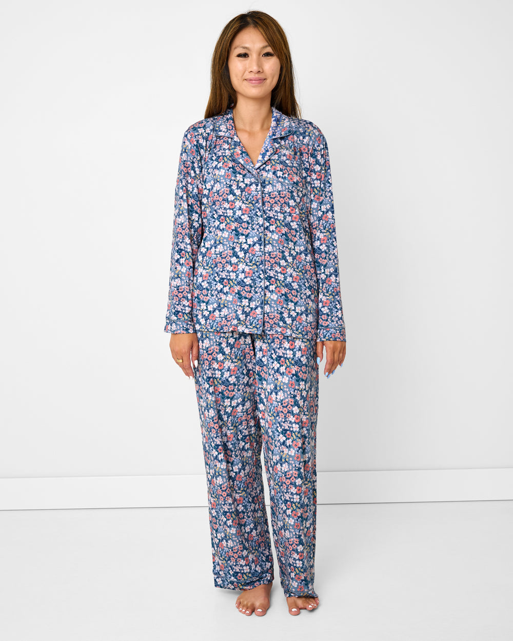 Standing woman wearing the Petite Petals Women's Long Sleeve Pajama Set