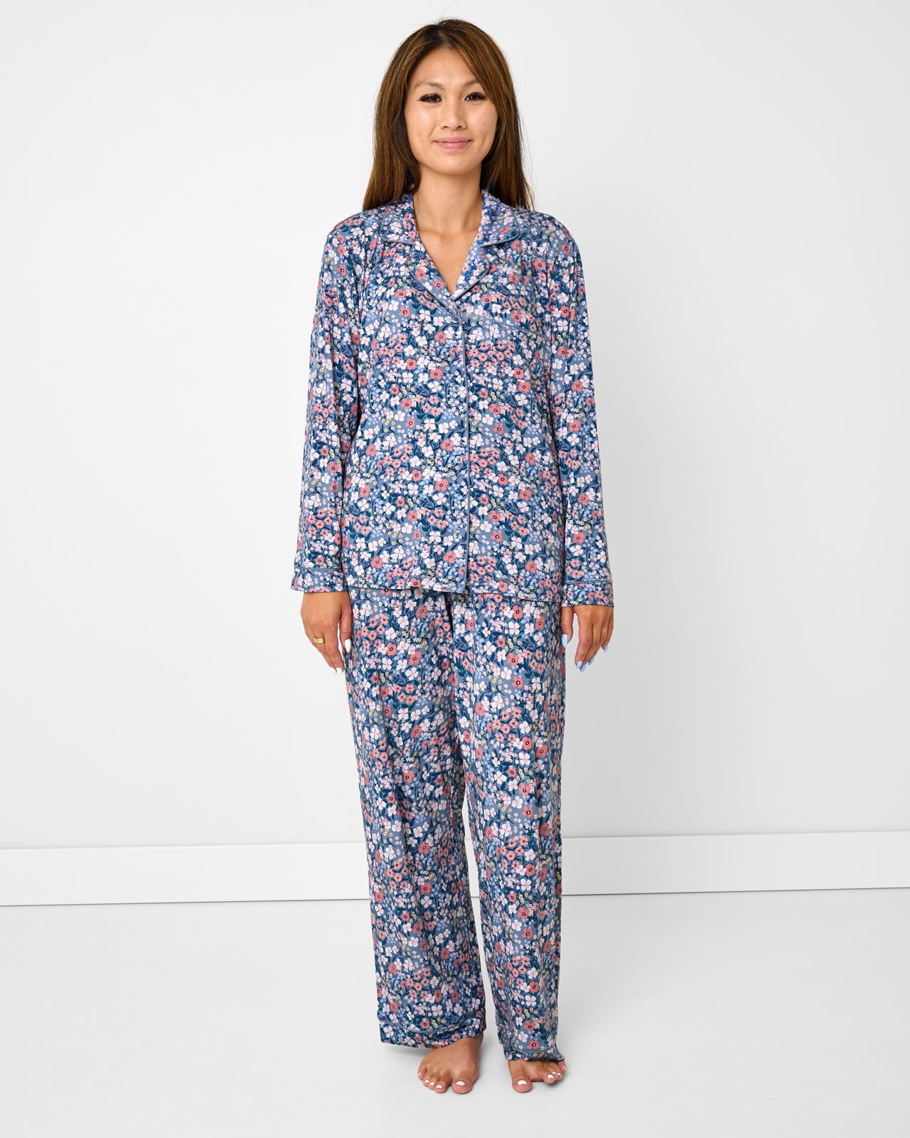 Standing woman wearing the Petite Petals Women's Long Sleeve Pajama Set