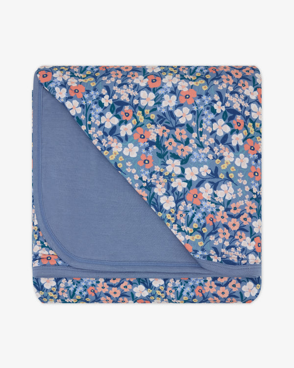 Flat lay of the Petite Petals Large Cloud Blanket®