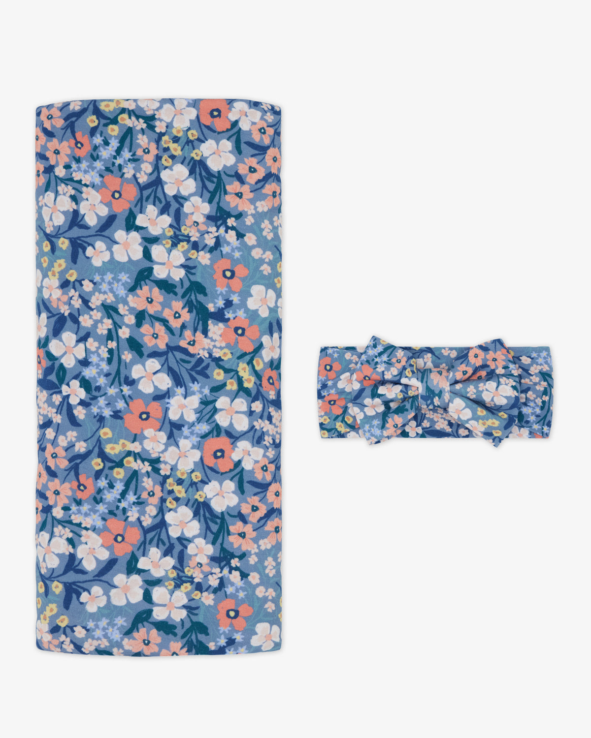 Flat lay of the Petite Petals Swaddle & Luxe Bow Headband Set