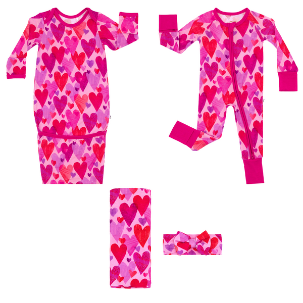 flat lay composite of a pink hearts & crafts zippy, infant gown, and swaddle & luxe bow headband set