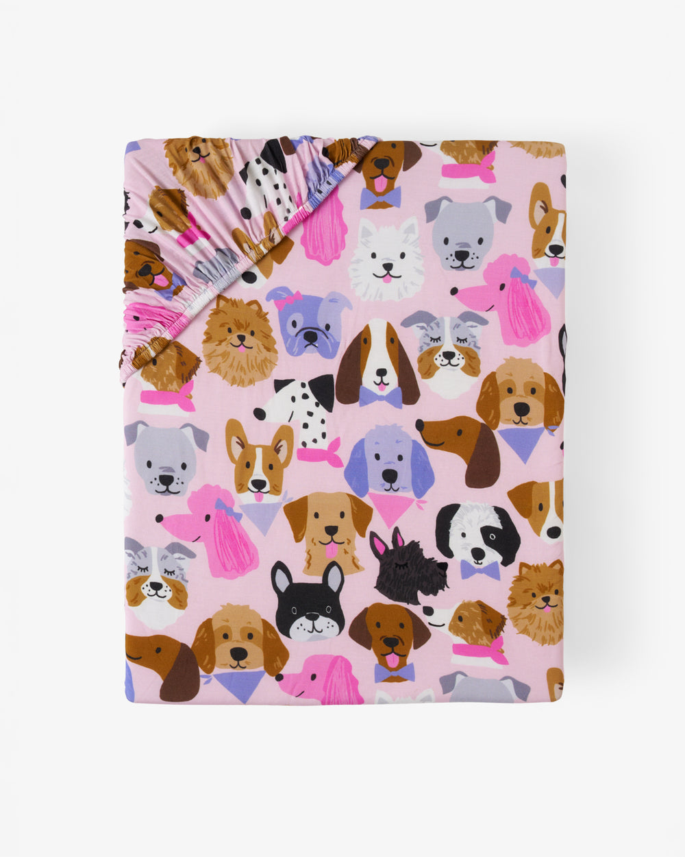 Flat lay of the Pink Puppy Parade Fitted Crib Sheet