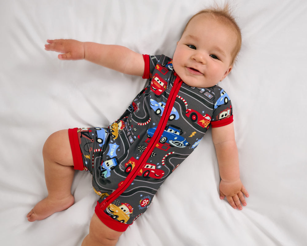 Aerial view of baby wearing the Disney & Pixar Piston Cup Shorty Zippy