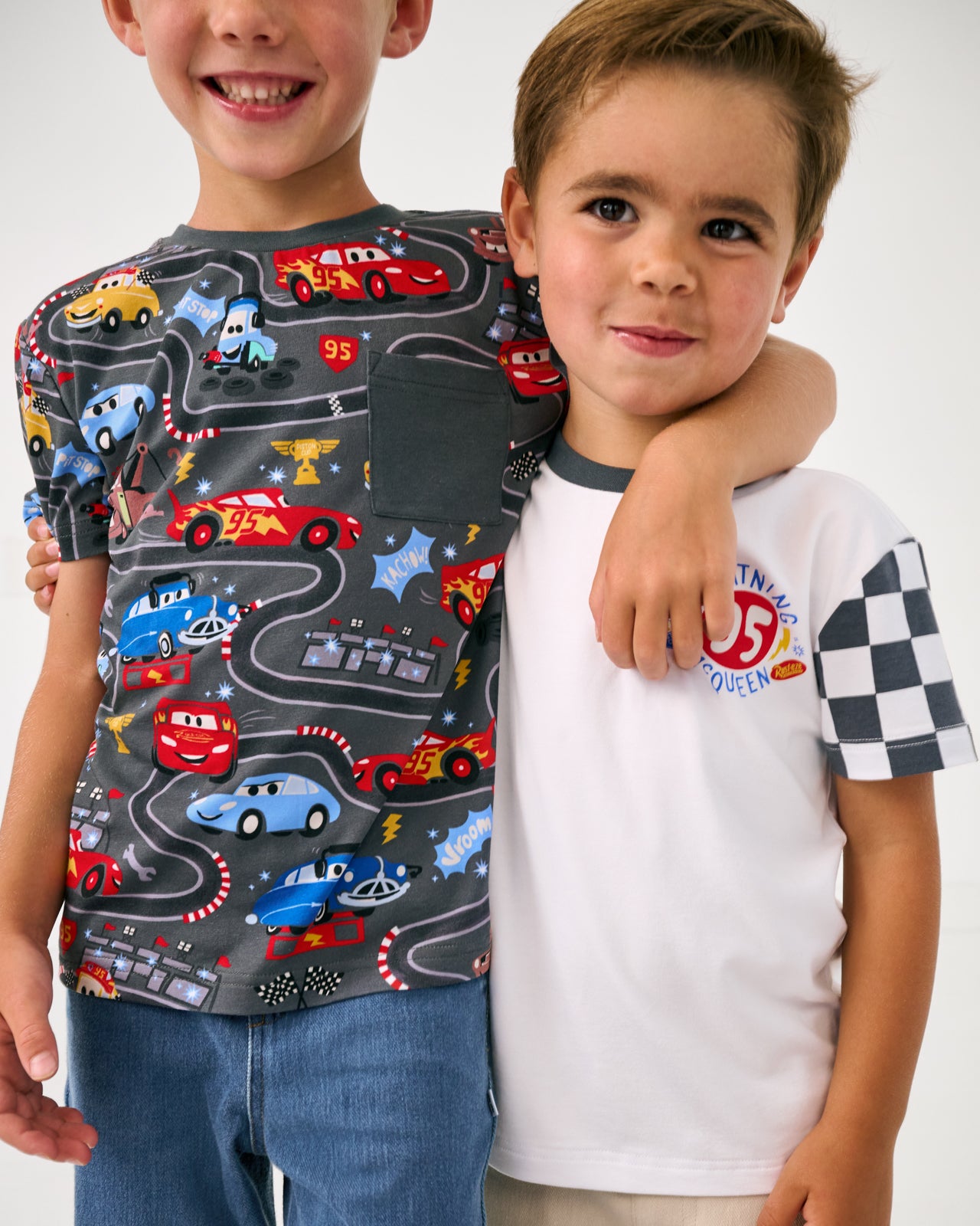 Front view close up of two boys wearing tshirts from the Disney Cars collection