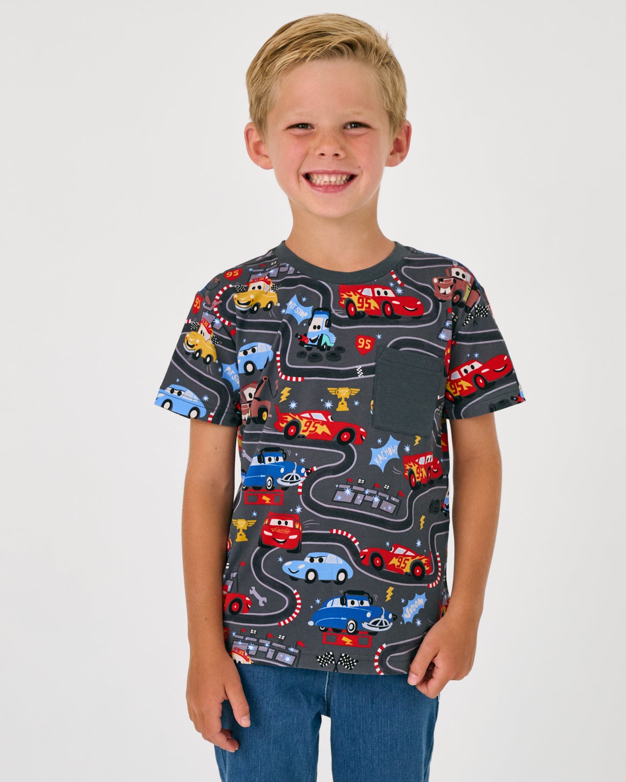 Boy wearing the Disney & Pixar Piston Cup Relaxed Pocket Tee