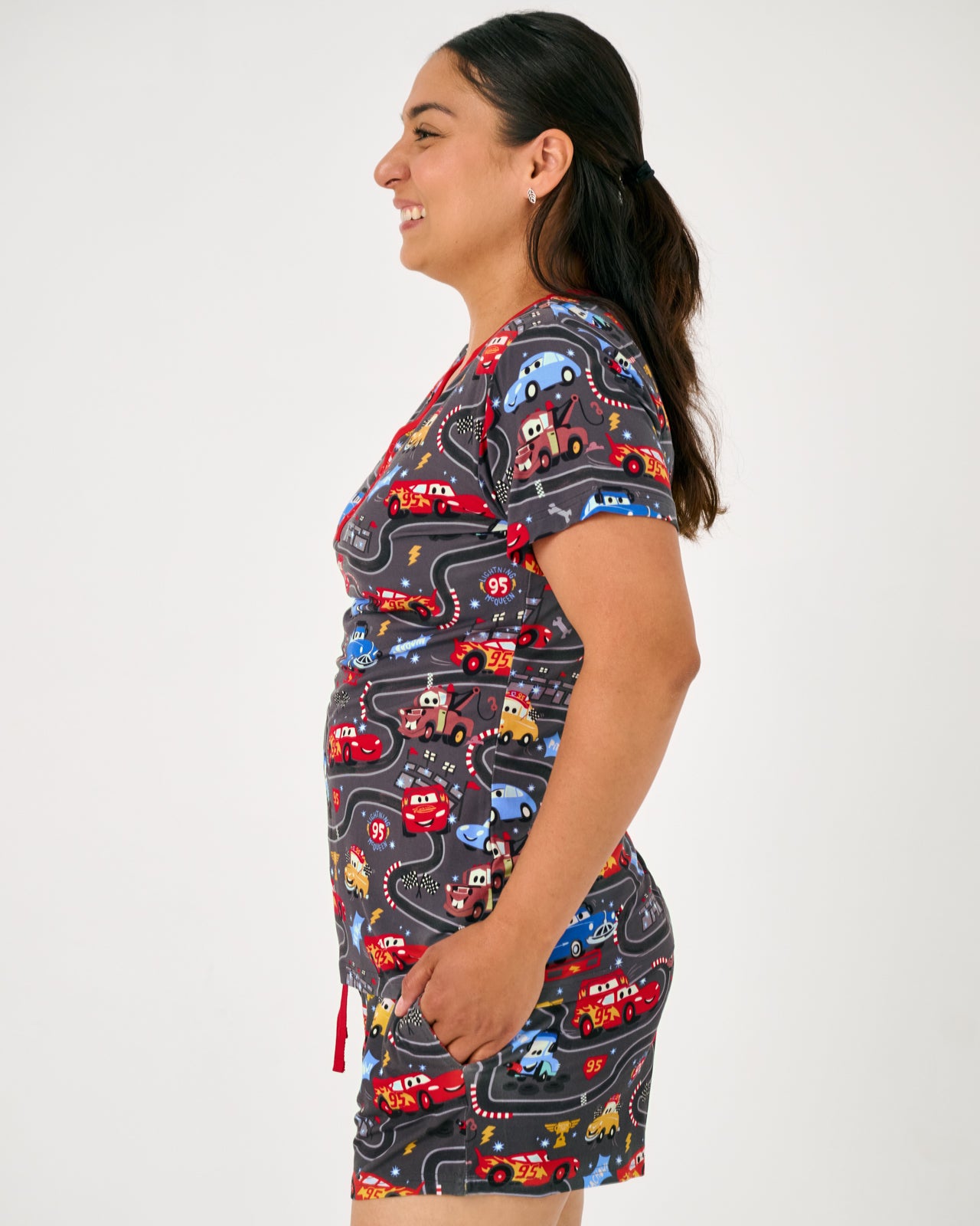 Side view of woman wearing the Disney & Pixar Piston Cup Women's Pajama Shorts