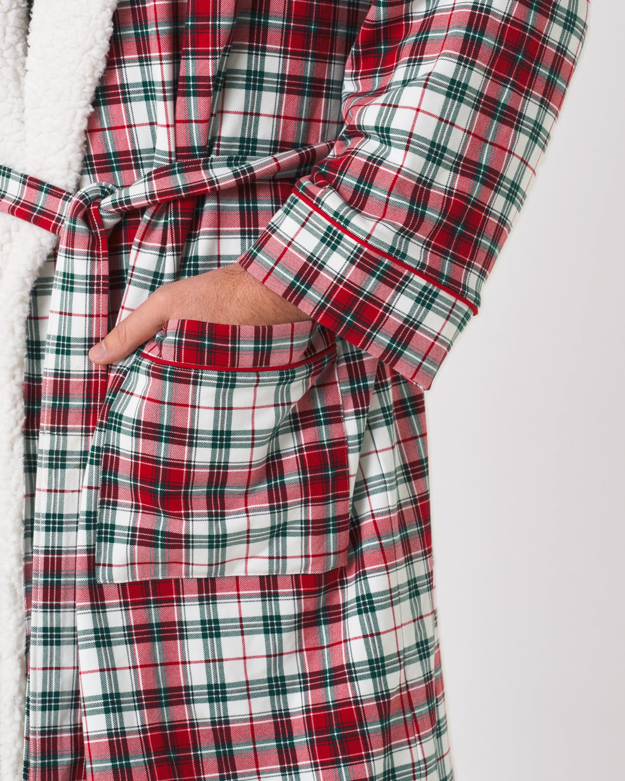 Close up shot of the Holly Plaid Cozy Robe with one hand in his pocket.
