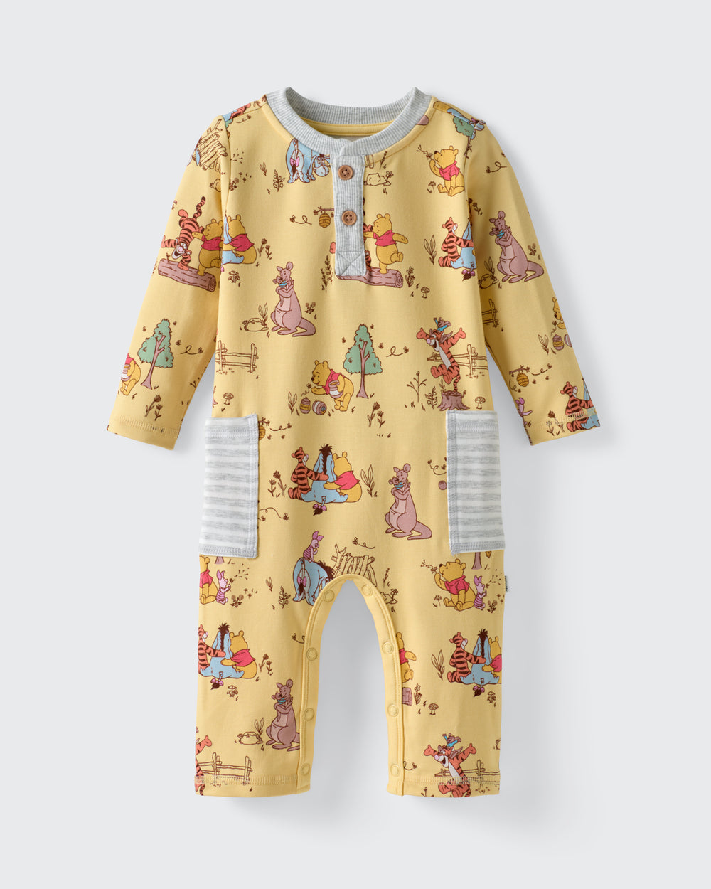 Flat lay of the Disney Playtime With Pooh Henley Romper