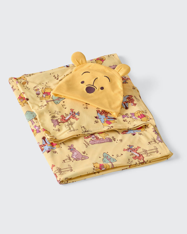Flat lay of the Disney Playtime With Pooh Swaddle & Hat Set