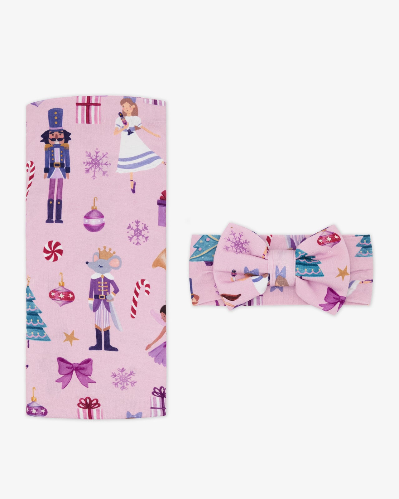 Flat lay of the Nutcracker Ballet Swaddle & Luxe Bow Headband Set