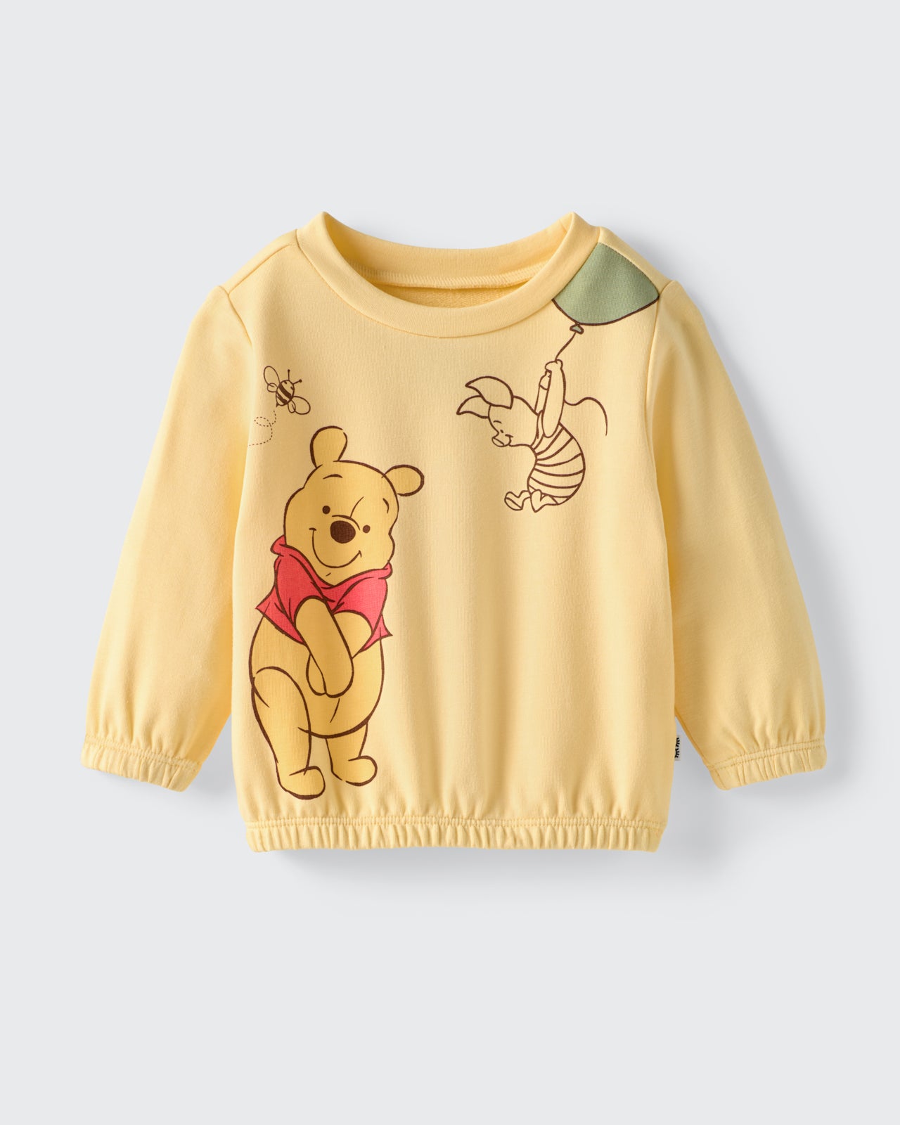 Flat lay of the Disney Winnie The Pooh Cinched Crewneck