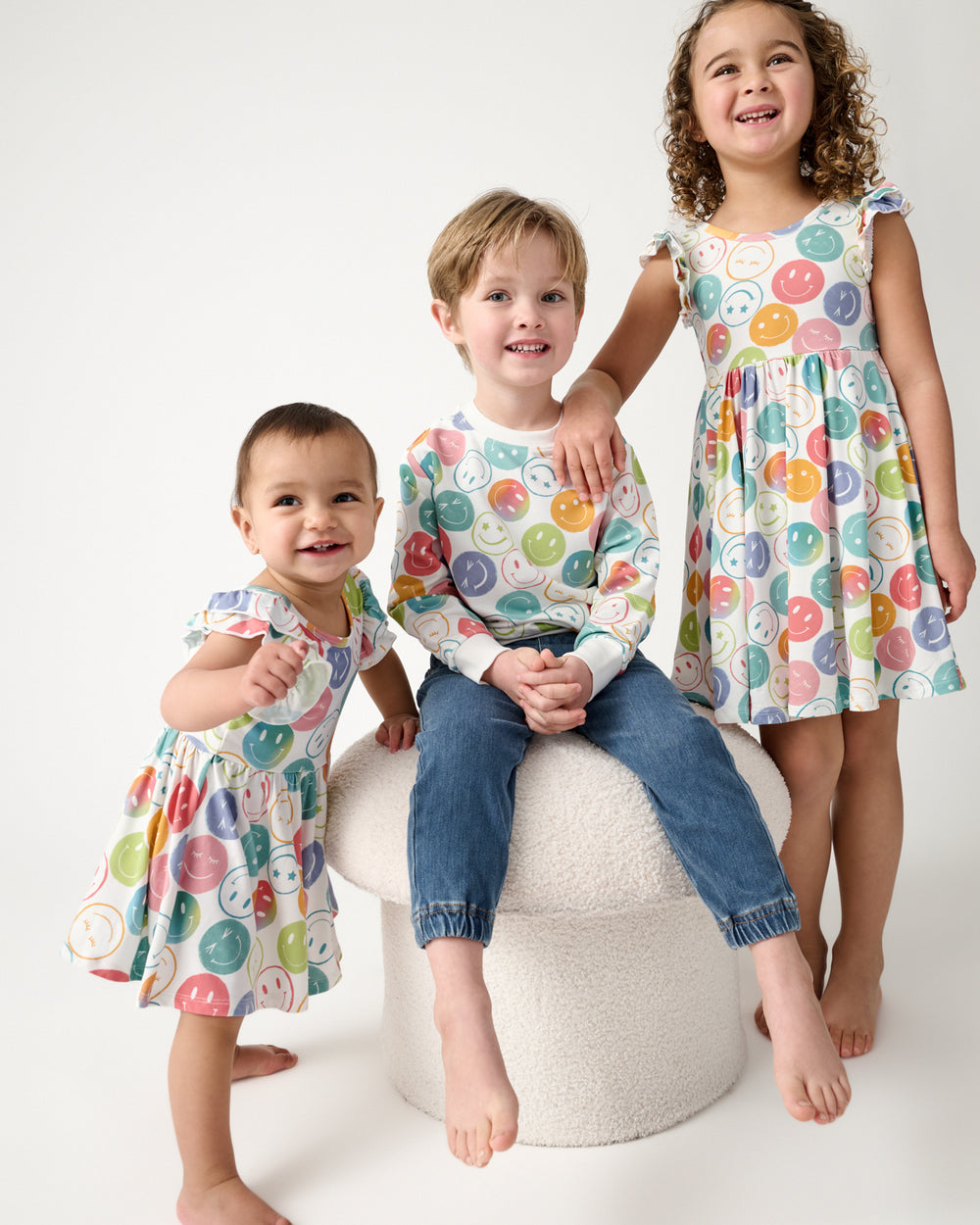 Group of three children wearing matching Positive Vibes play styles