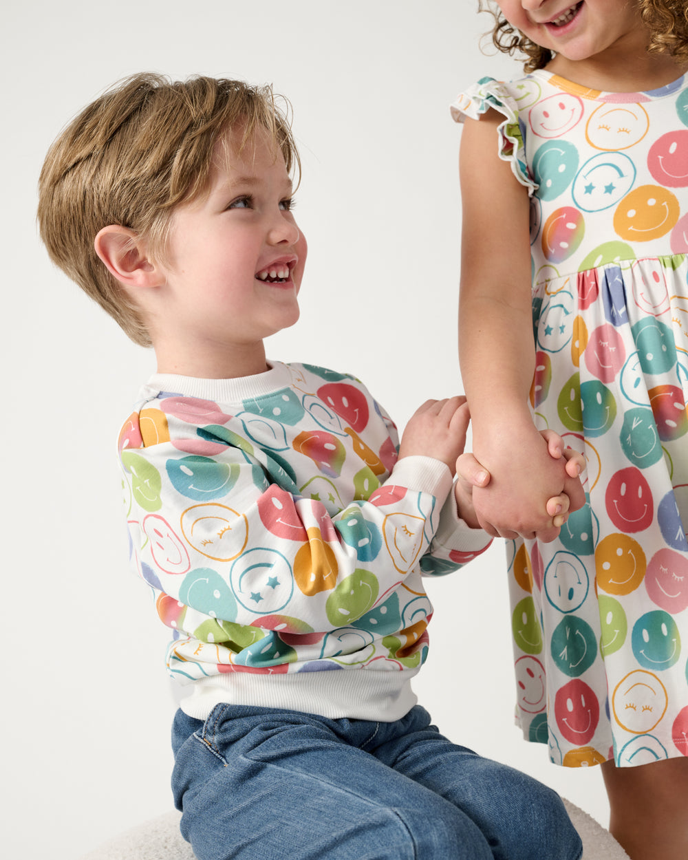 Two kids wearing matching Positive Vibes play styles