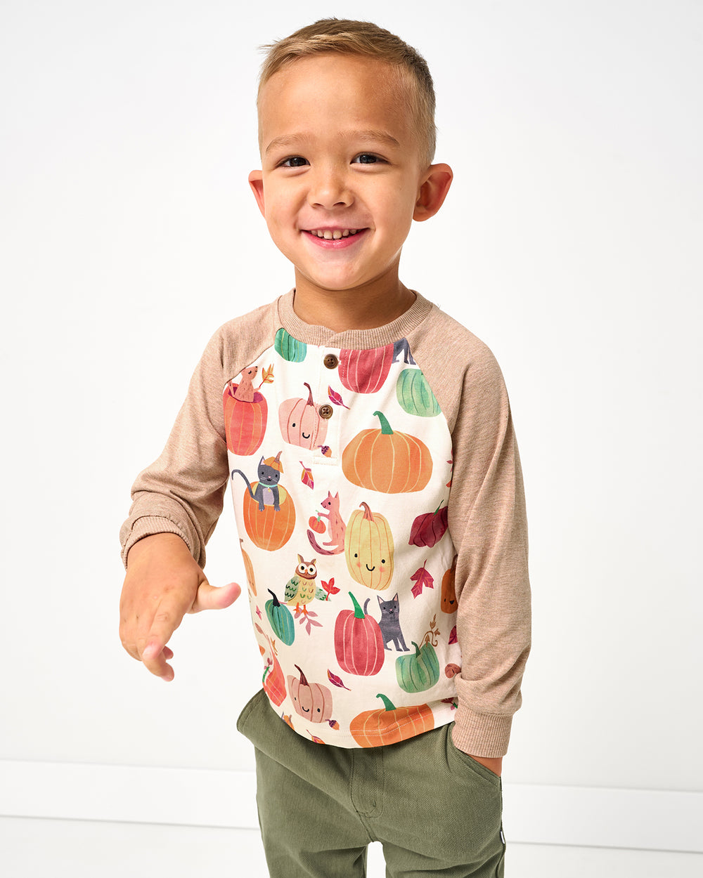 Boy wearing the Pumpkin Pals Raglan Henley Tee