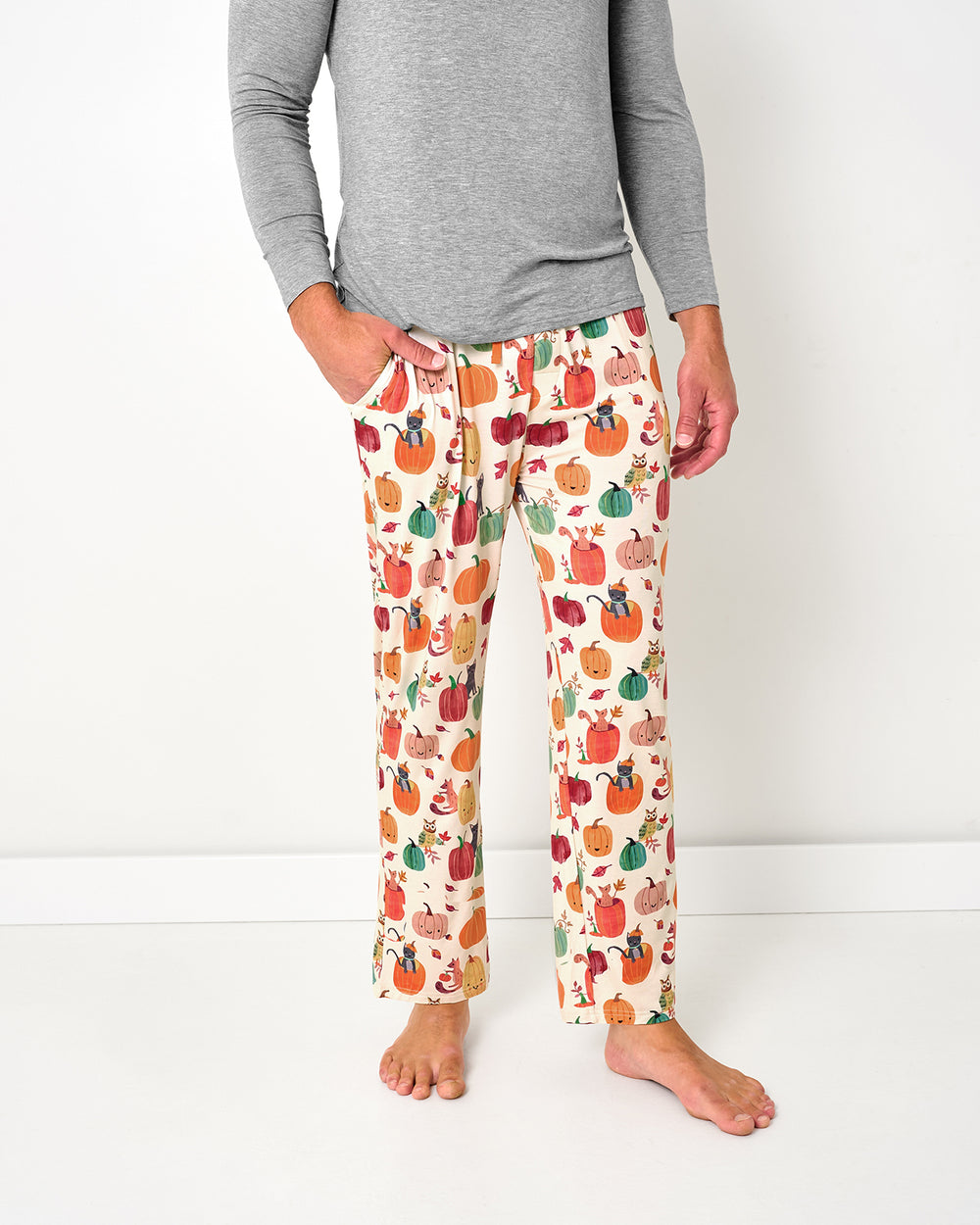 Man wearing the Pumpkin Pals Men's Pajama Pants