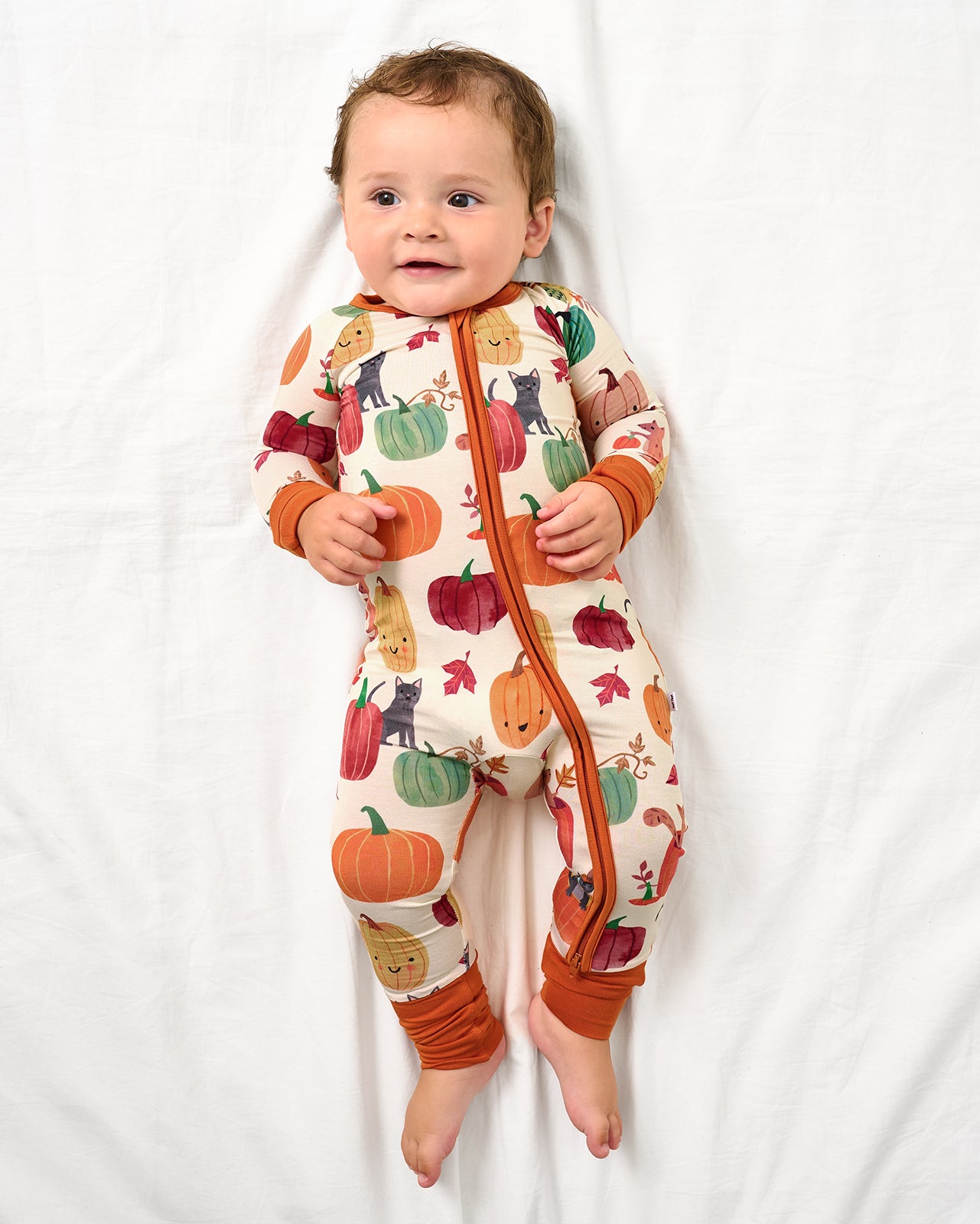 Baby wearing the Pumpkin Pals Zippy