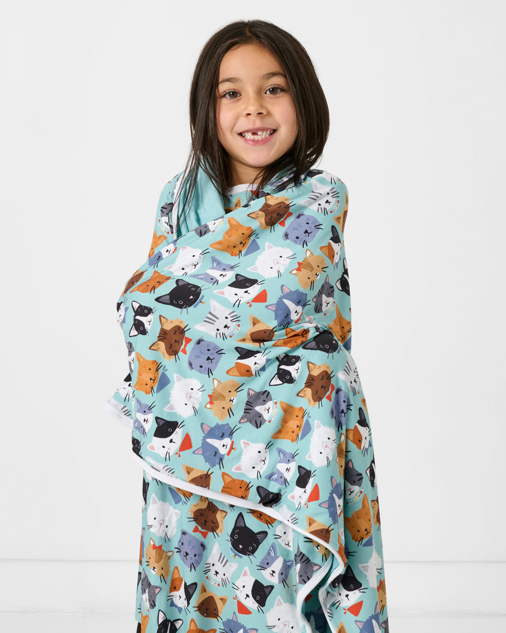 Girl wrapped in the Purrfect Pals Large Cloud Blanket®