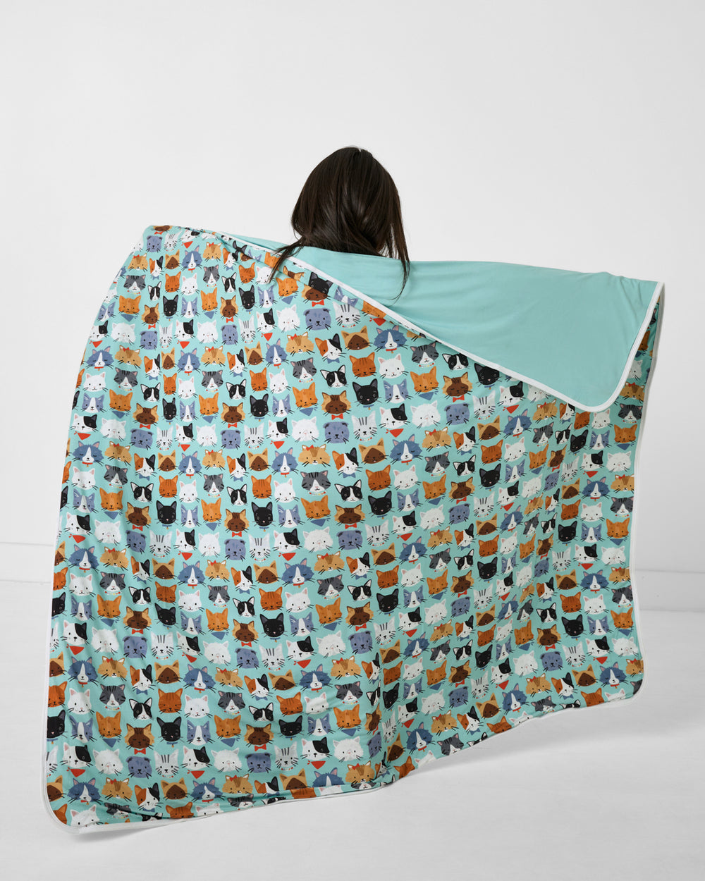 Child holding up the Purrfect Pals Large Cloud Blanket®