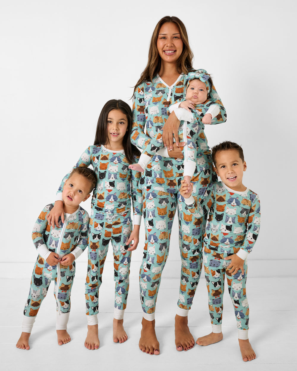 Mother and four children wearing matching Purrfect Pals bamboo cat pajamas