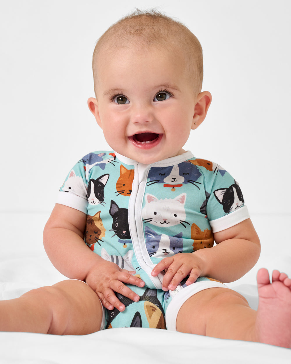 Sitting baby wearing the Purrfect Pals Shorty Zippy