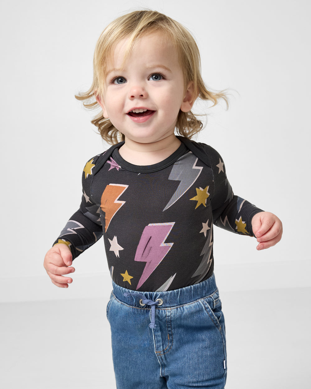 Baby wearing the Rad Bolts Bodysuit with denim pants