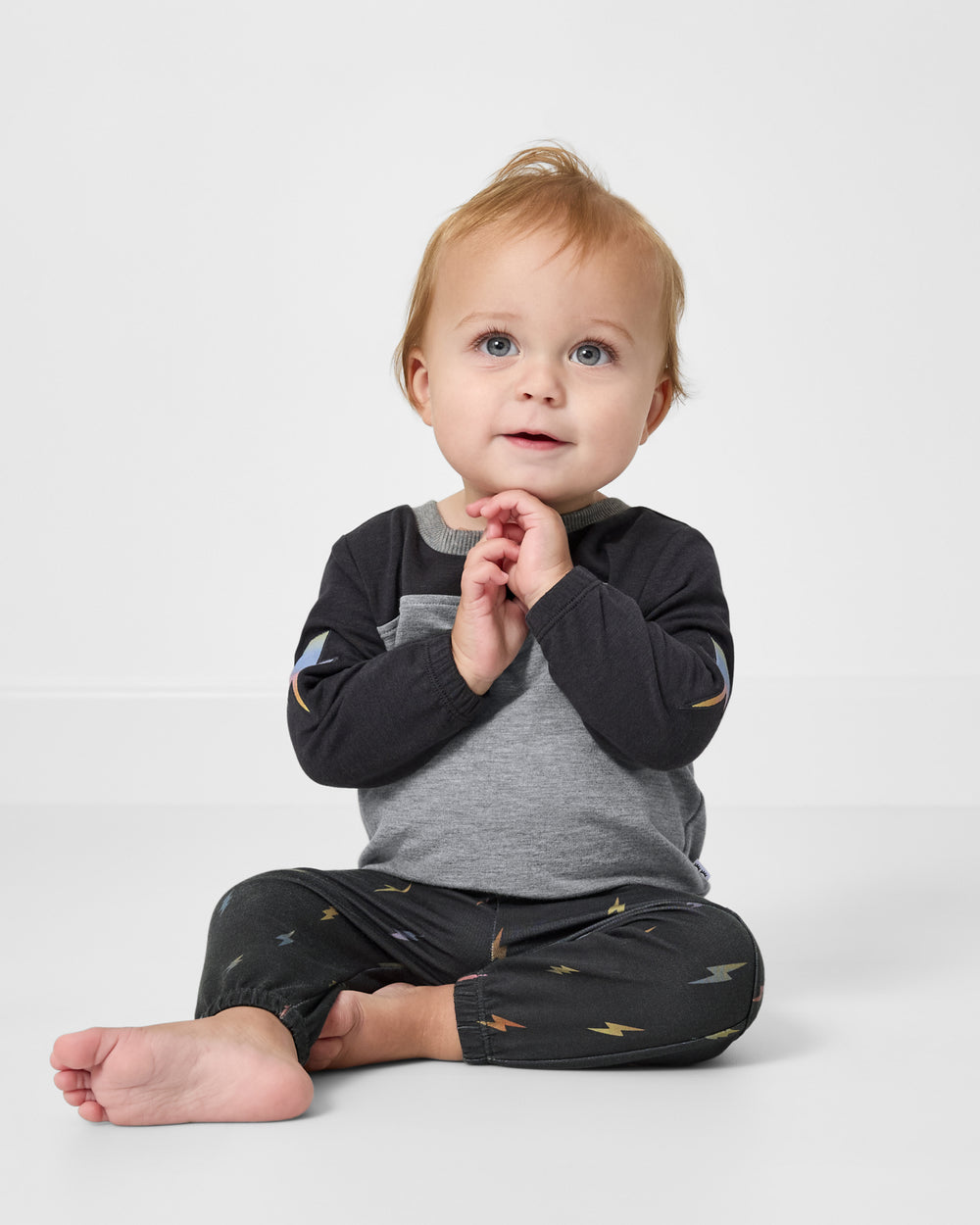 Sitting baby wearing the Rad Bolts Cinched Jogger