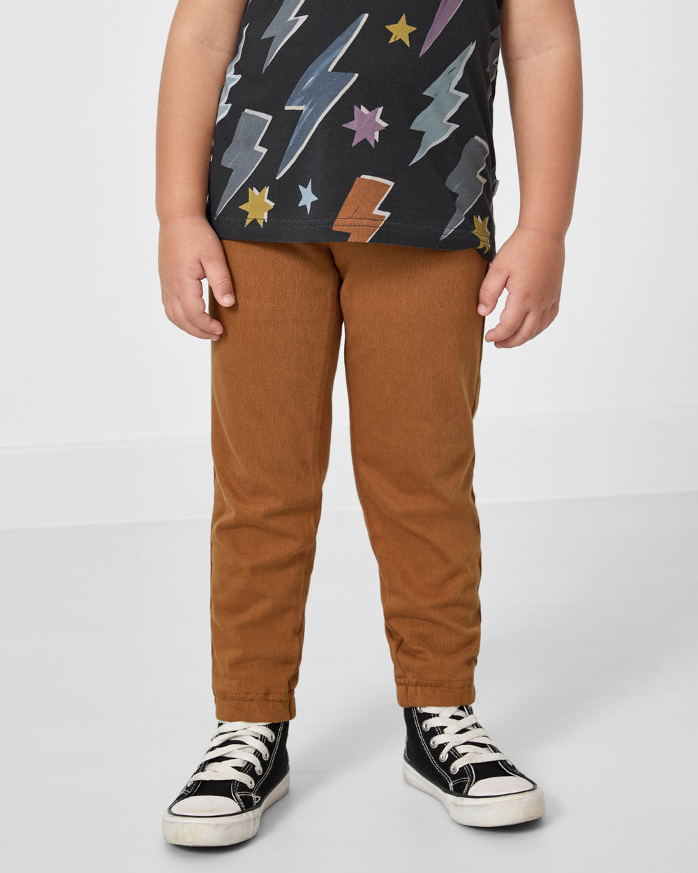 Front view of boy wearing the Rich Toffee Denim Jogger