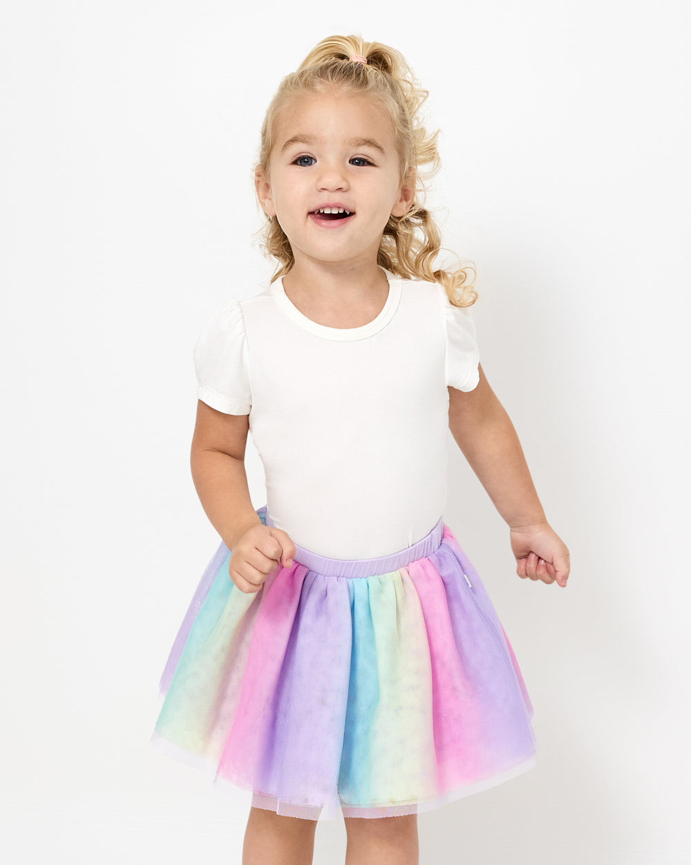 Girl wearing the Rainbow Tutu Skirt with a white girls shirt